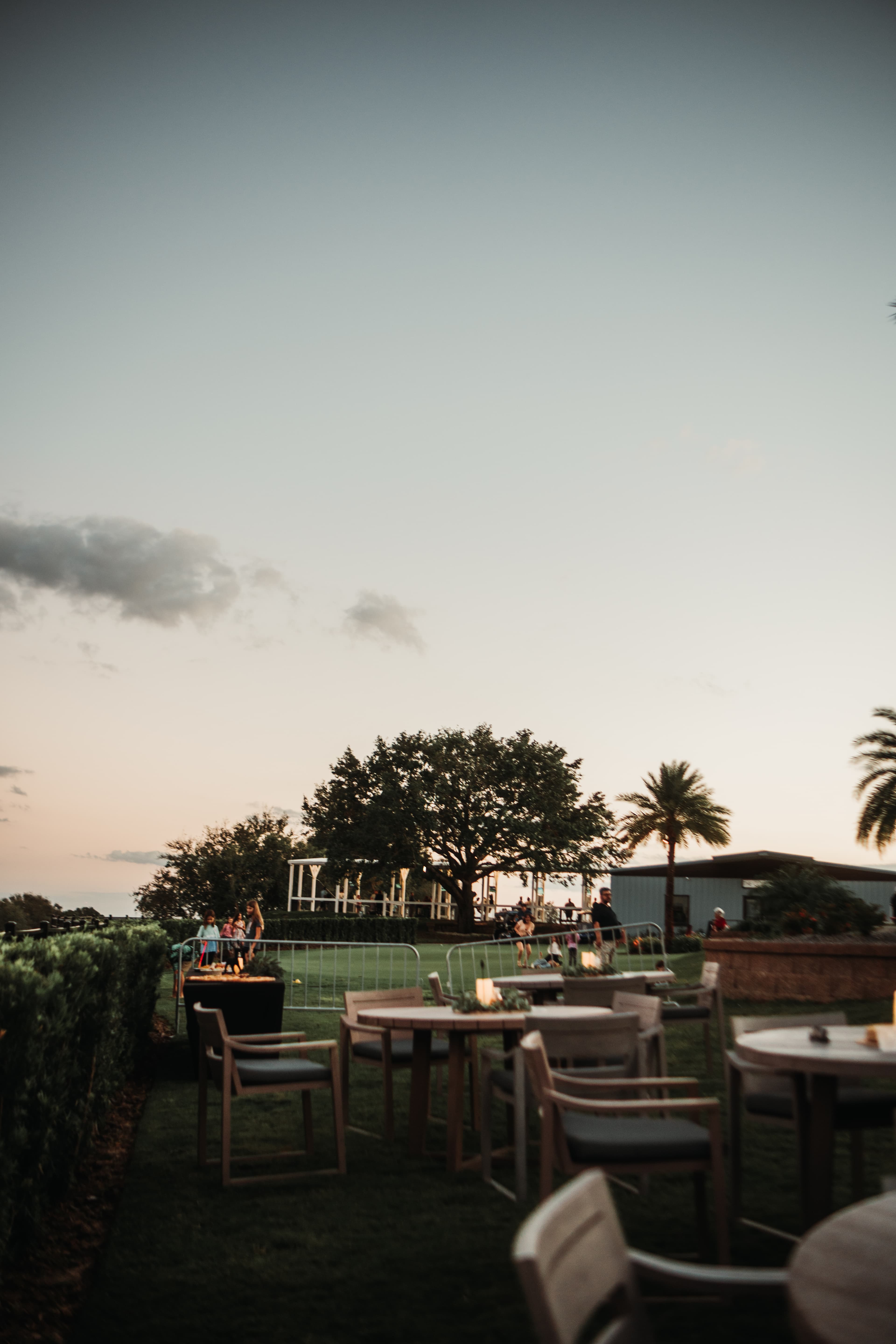 Guests enjoying the outdoor patio and dining at golden hour